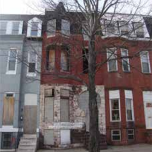Before: The deteriorating façade of this brownstone in Baltimore is typical of the need for rehabilitation of homes in the city's historic Oliver neighborhood. (TD Bank)